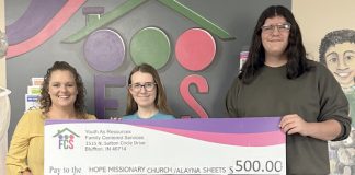 YAR Board members present check to grant recipients