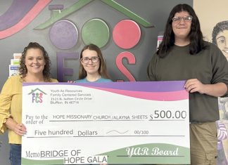 YAR Board members present check to grant recipients