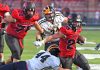 Tigers offense, defense, march all over Raiders in season opening victory