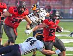 Tigers offense, defense, march all over Raiders in season opening victory
