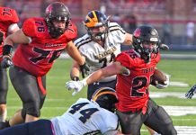 Tigers offense, defense, march all over Raiders in season opening victory